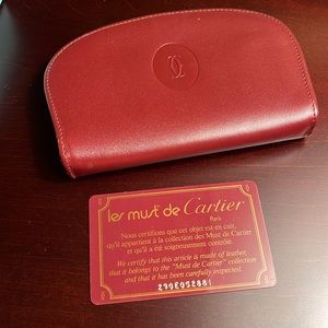 Cartier zippered small burgundy wallet. Classic excellent condition